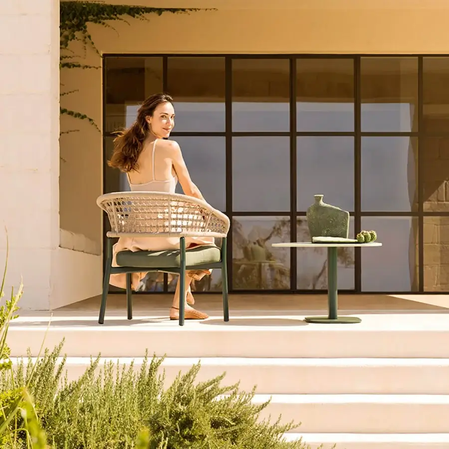 Exceptional Varaschin Plinto lounge armchair with neutral beige woven seat and matte light green powder-coated aluminum frame