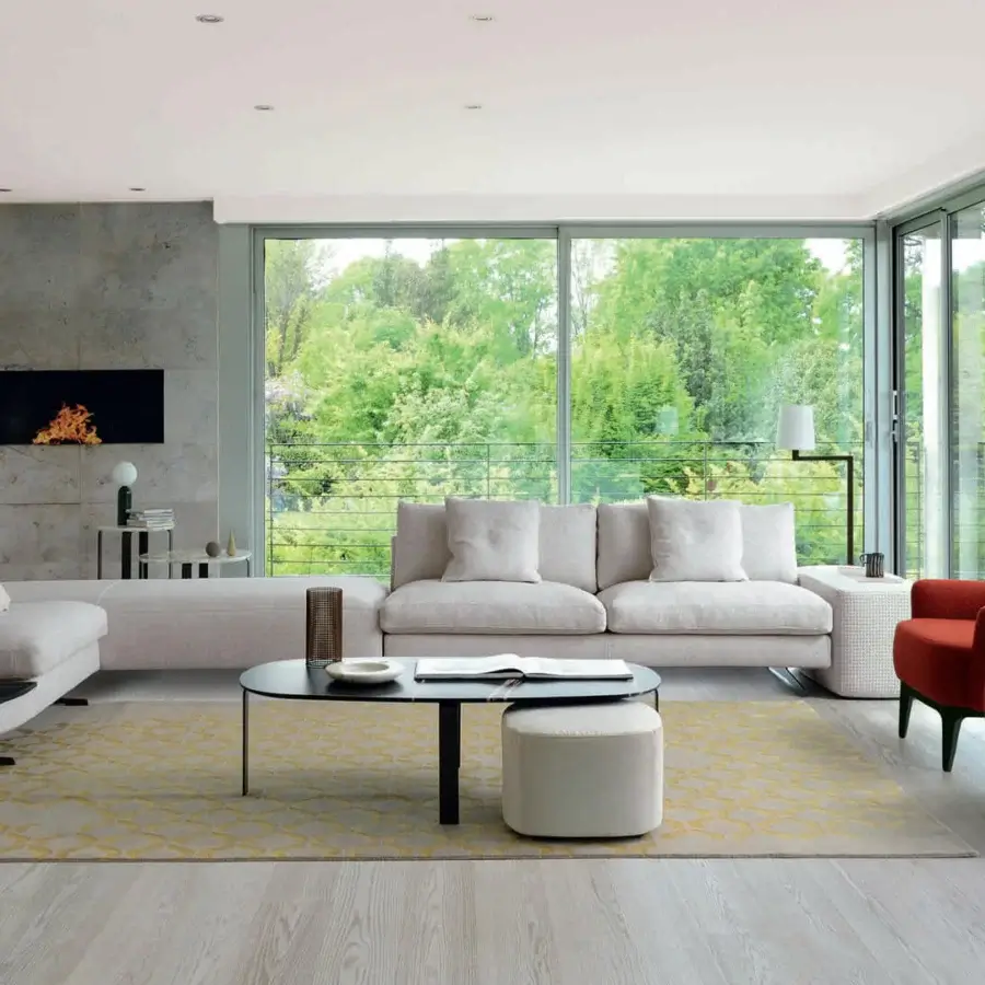 Distinguished CTS Salotti Allure coffee table with a sleek dark gray metal base and refined glossy glass tabletop crafted in Italy