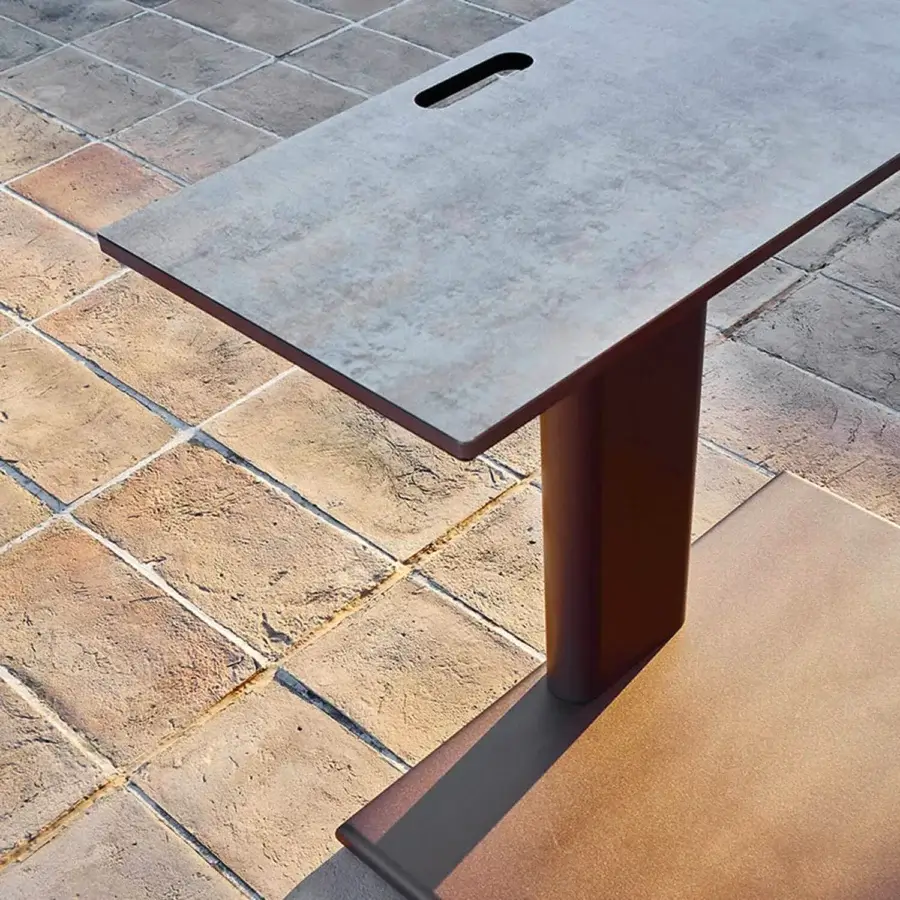 Distinguished Varaschin Plinto sit and eat table with dark grey matte finish and brownish-red metal base