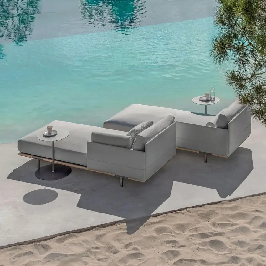 Refined Ethimo Baia daybed crafted with fabric upholstery and a wood base in a light gray finish for comfortable outdoor relaxation