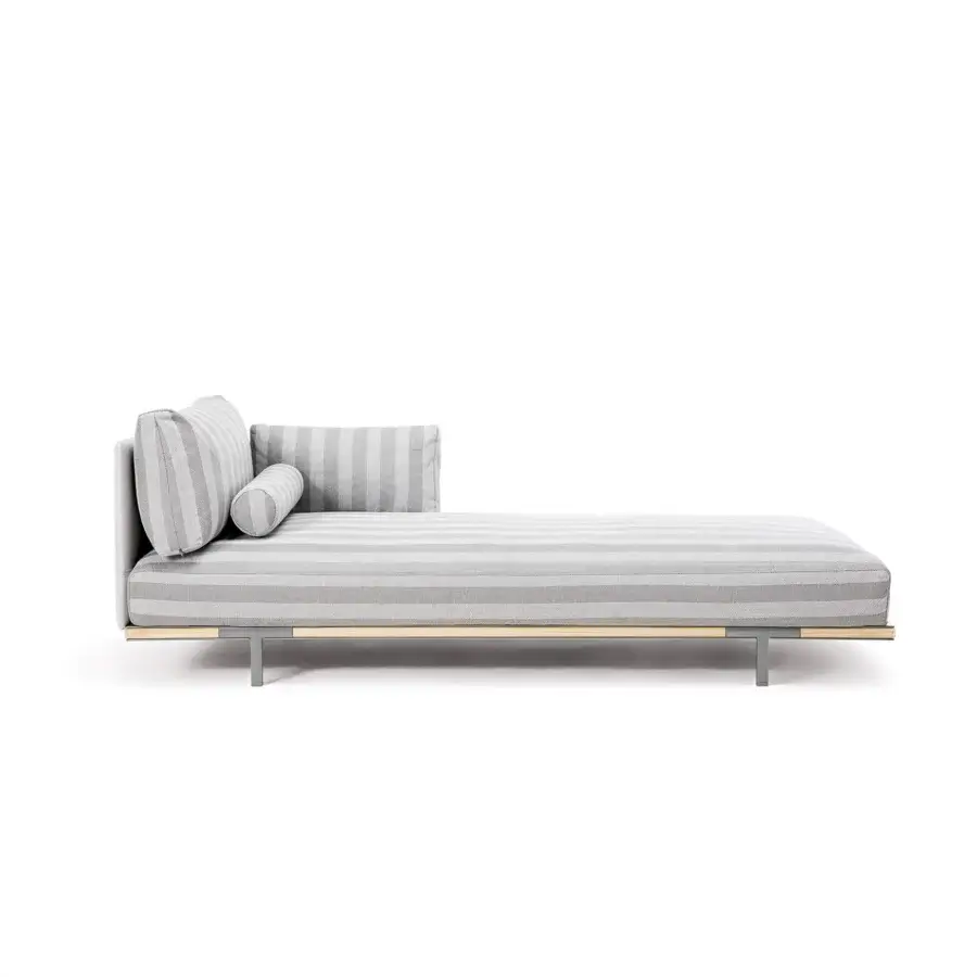 Sophisticated Ethimo Baia daybed crafted with striped fabric upholstery and comfortable cushions presenting a nautical sensibility