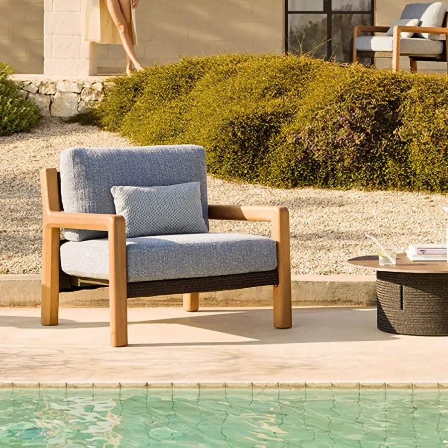 Exceptional Varaschin Gianna lounge chair with aluminum, Iroko wood sides, soft blue-gray cushions and a satin finish