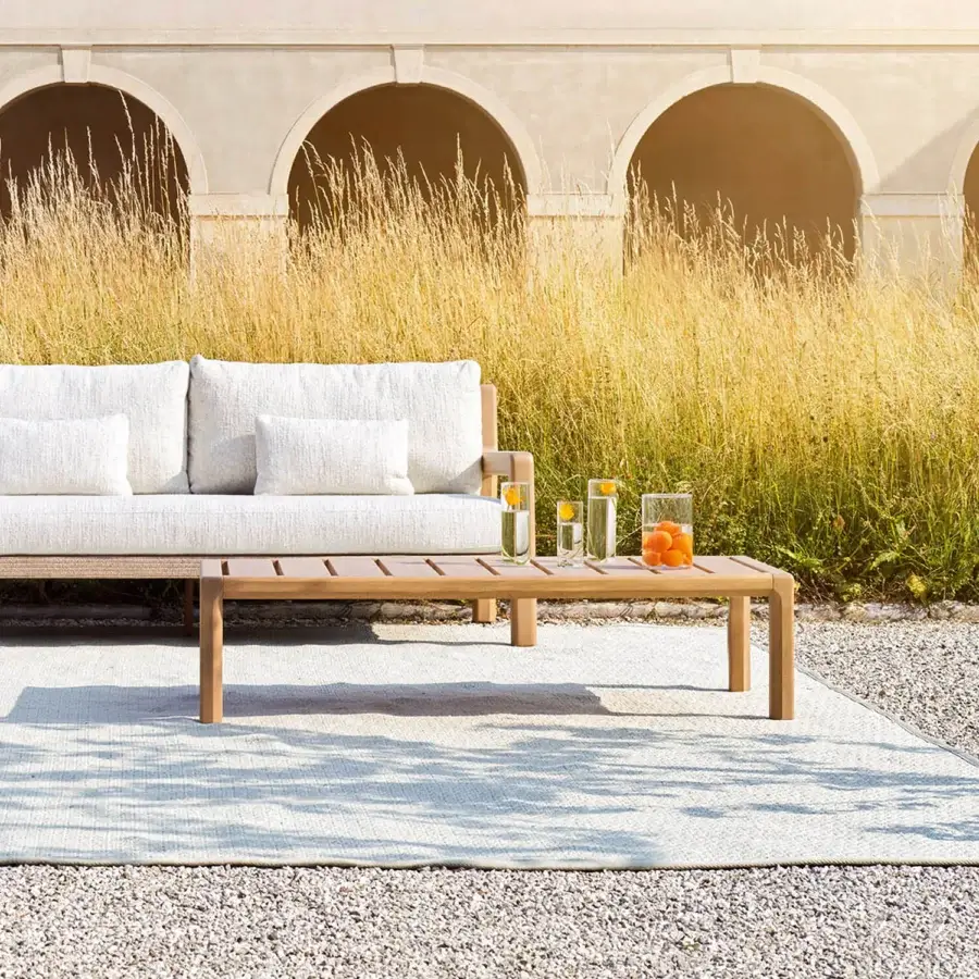 Distinguished Varaschin Gianna coffee table built in Iroko wood with a smooth satin finish and warm medium-toned hue