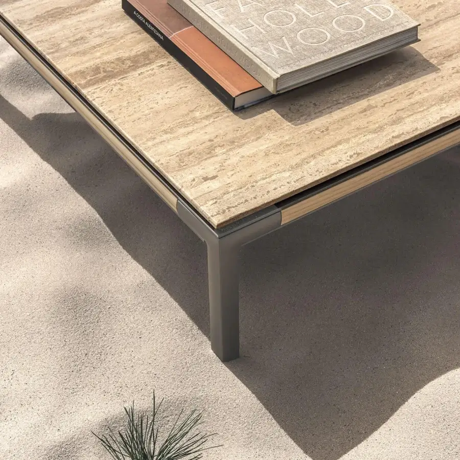 Superior Ethimo Baia coffee table with warm beige striated stone tabletop and muted gray metal base crafted in Italy