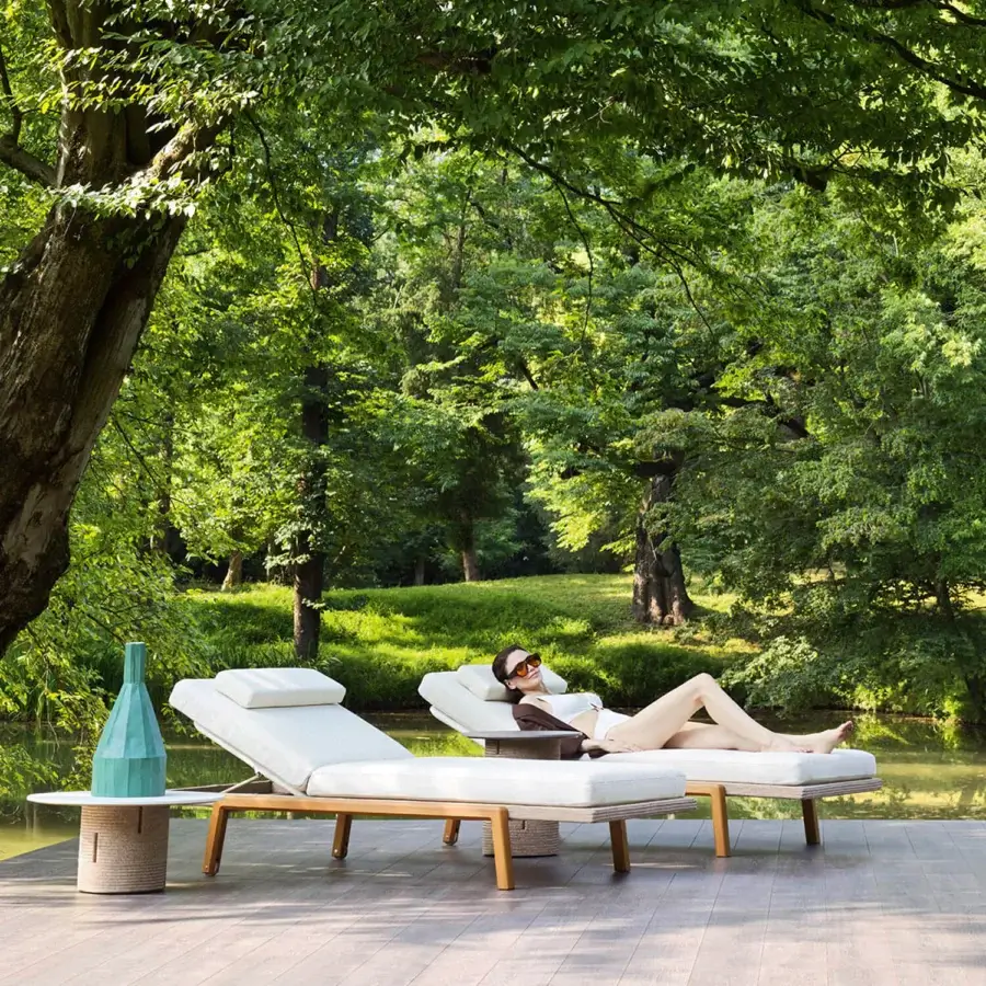 Superior Varaschin Gianna lounger with wheels in off-white upholstery and visible Iroko wood aluminum platform