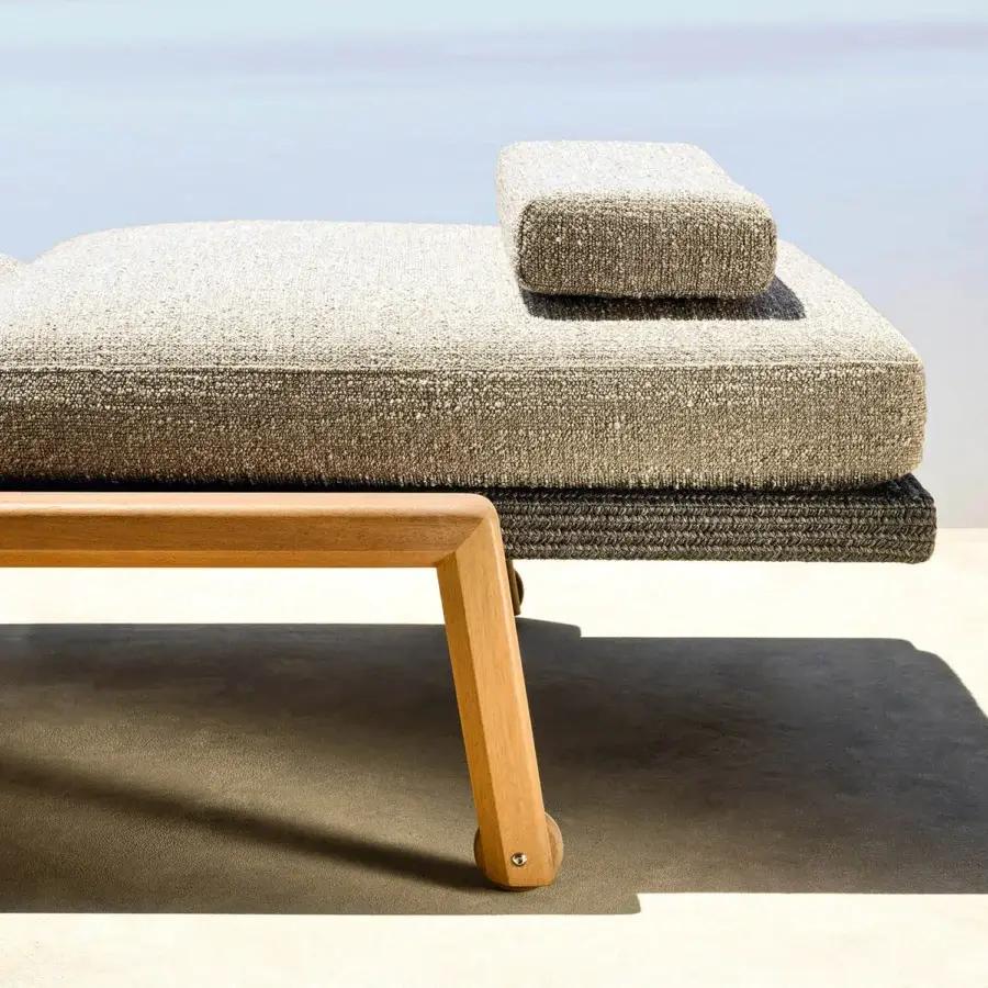 Elegant Varaschin Gianna lounger with wheels, crafted in aluminum and Iroko wood with neutral beige textile upholstery