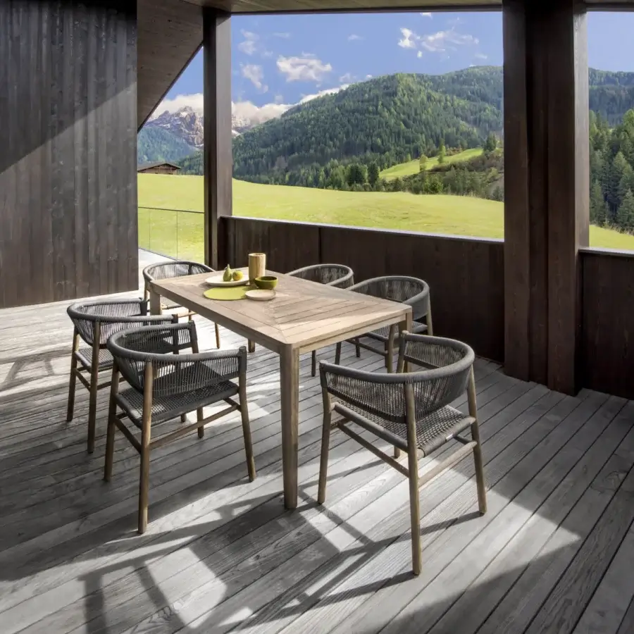Sophisticated Ethimo Kilt armchair crafted with FSC-certified teak and durable natural fiber weave in warm brown and subtle grey