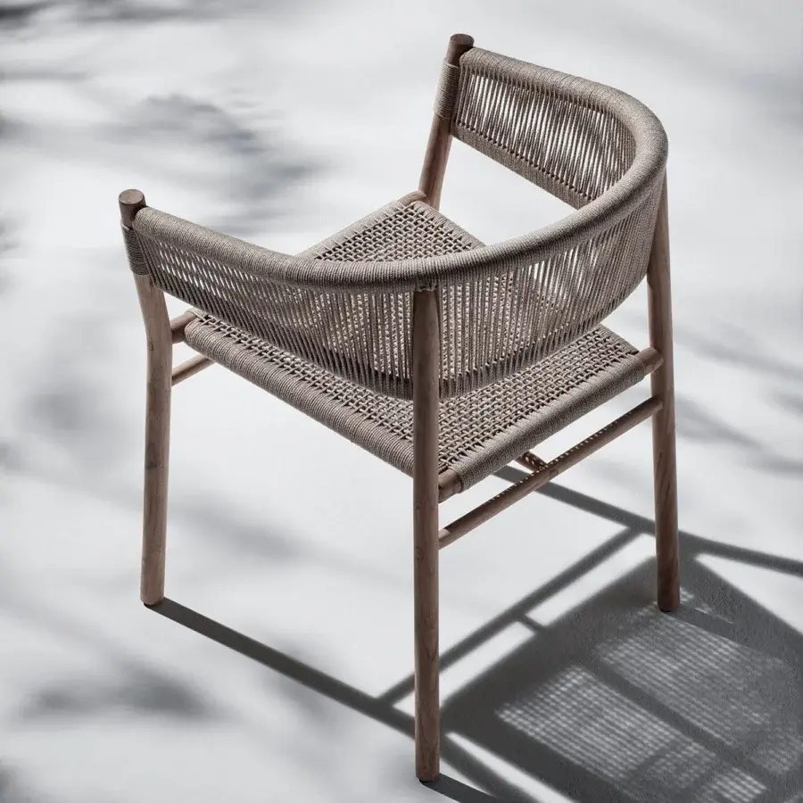 Exceptional Ethimo Kilt armchair crafted in FSC-certified teak with a muted gray natural fiber woven seat and back