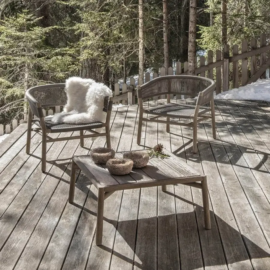 Elegant Ethimo Kilt coffee table crafted in muted grey-brown teak with visible wood grain and matte finish
