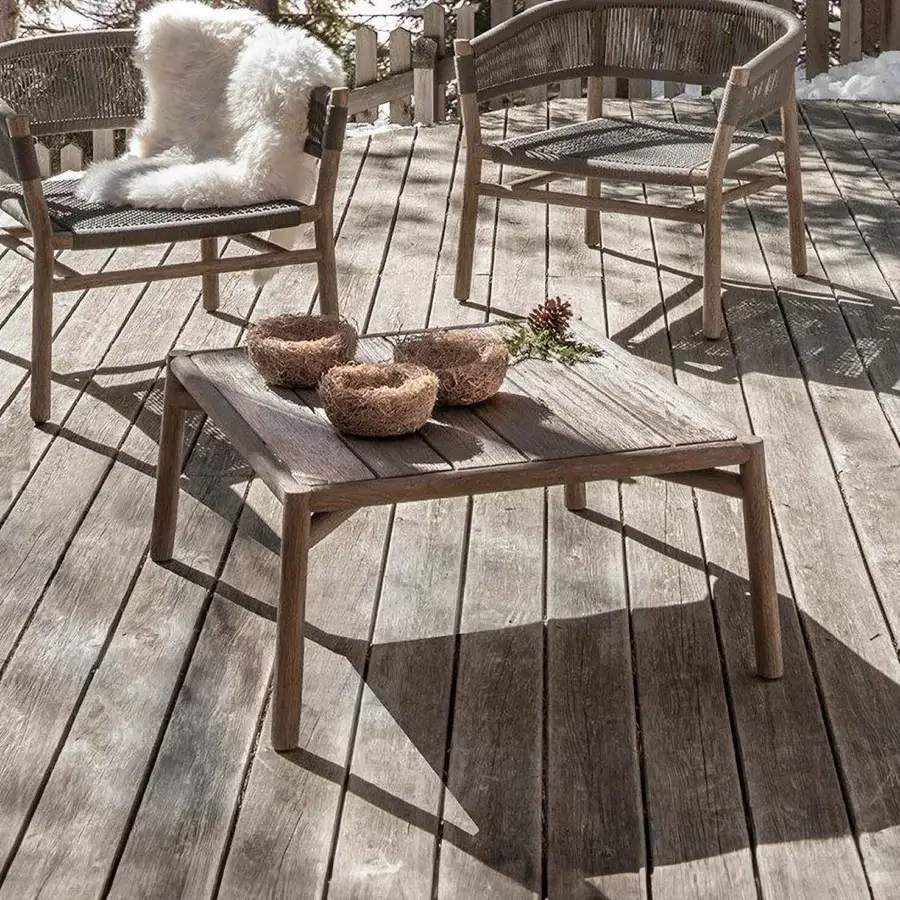 Distinguished Ethimo Kilt coffee table crafted in muted gray-brown teak with a matte, textured finish and visible wood grain