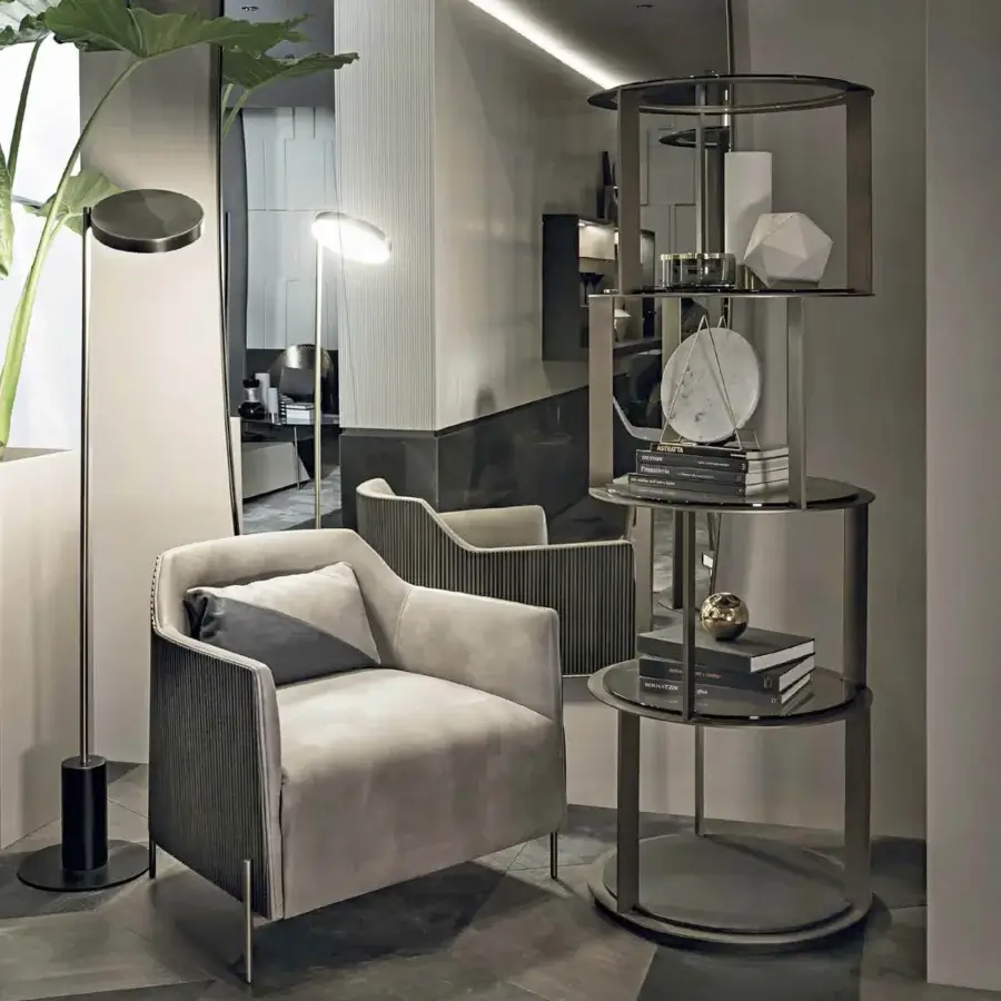 Distinguished Shake Sahara bookcase with a sleek varnished steel frame and blockboard ash wood base, showcasing transparent tempered glass shelves in bronze-toned metal