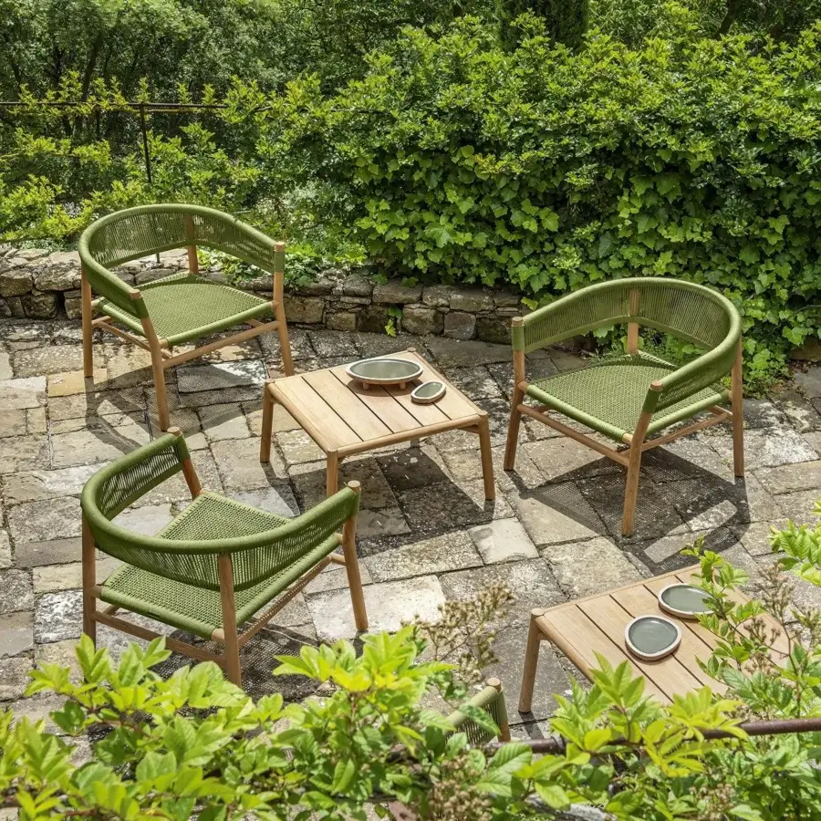 Distinguished Ethimo Kilt lounge chair with gently curved form and inviting woven olive green textile crafted in FSC-certified teak