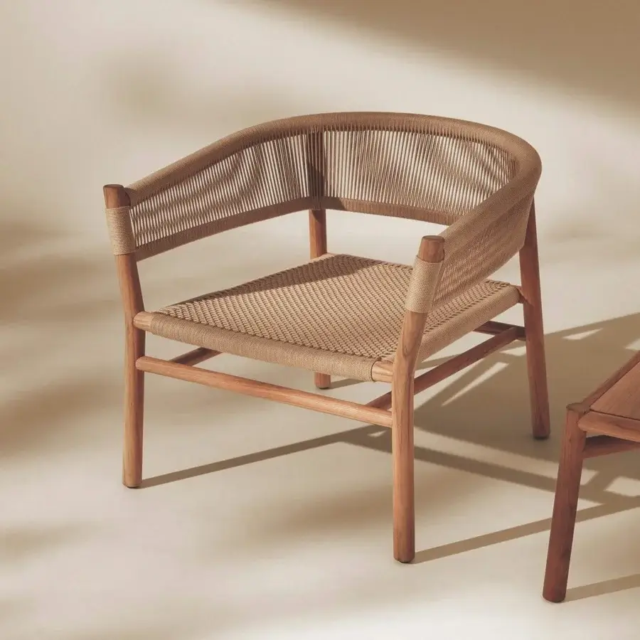 Sophisticated Ethimo Kilt lounge chair crafted with FSC-certified teak and natural fiber weave in warm brown and beige tones