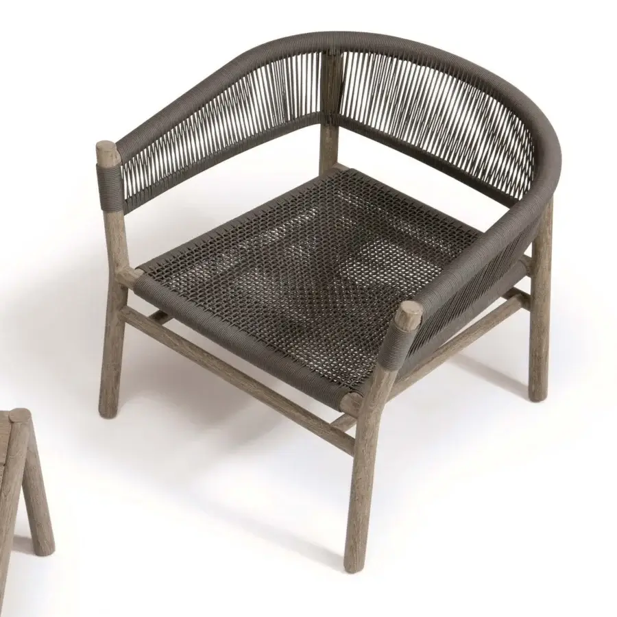 Lavish Ethimo Kilt lounge chair crafted with FSC-certified teak and dark grey natural fibre weave with a warm wood finish