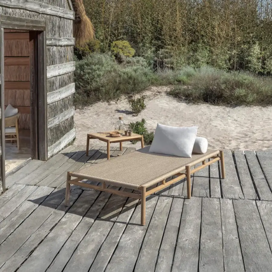 Distinguished Ethimo Kilt lounger crafted with FSC-certified teak and natural fiber weave in a light satin finish