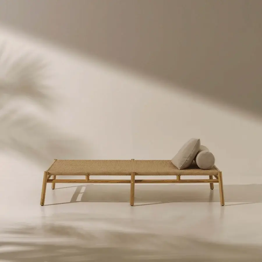 Lavish Ethimo Kilt lounger crafted with FSC-certified teak and a delicate natural fibre weave for inviting outdoor relaxation