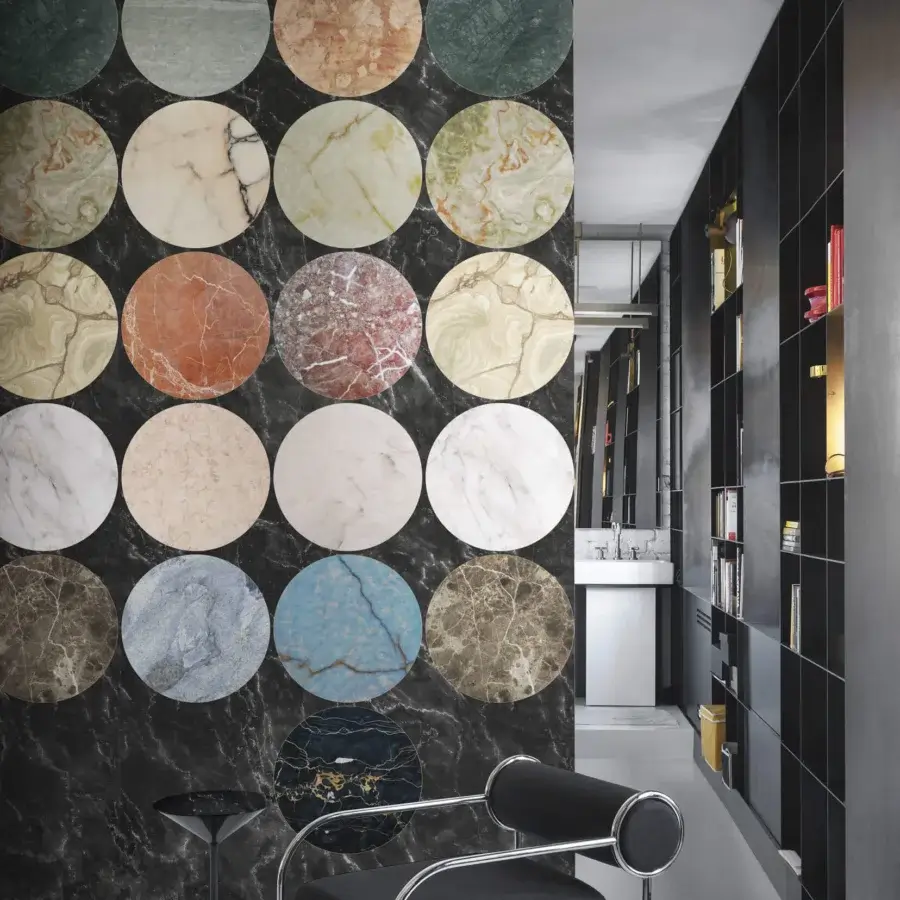 Exceptional LondonArt Lithos wallpaper displays a grid of circular elements in green, beige, red, blue, gray, and brown with a satin finish