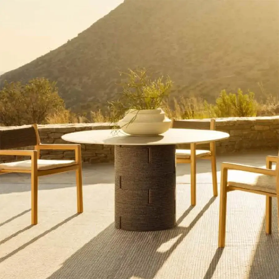 Distinguished Varaschin Gianna table with cylindrical aluminum base and light-colored HPL tabletop in matte Desert finish