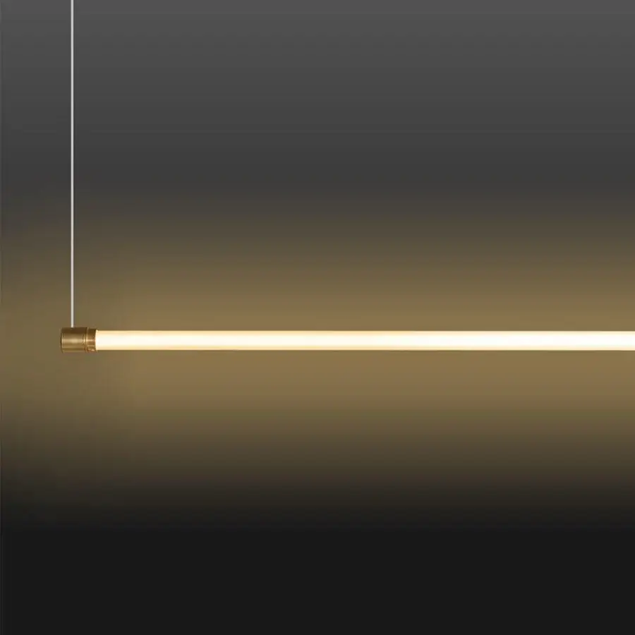 Refined Stillux Line 1 suspension lamp crafted in translucent material with satin brass end caps and integrated LED tubes