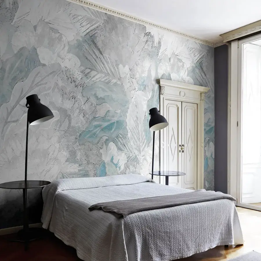 Distinguished LondonArt Welcome Back wallpaper displays layered plants and grasses in cool blue and gray hues with a subtle matte finish
