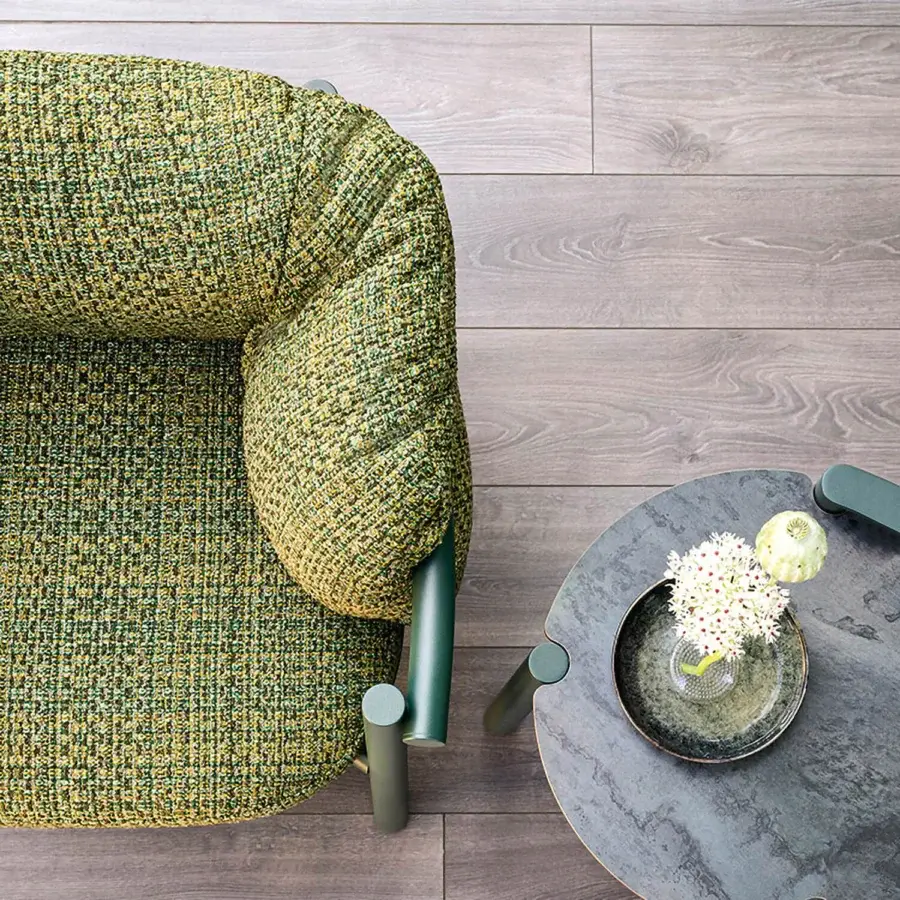 Sophisticated Varaschin Allegra lounge chair with a rounded form and woven green and yellow fabric upholstery with a matte finish