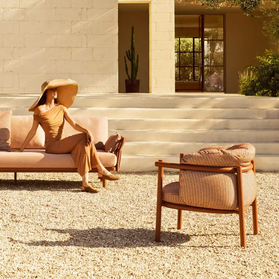 Distinguished Varaschin Allegra lounge chair with a durable aluminum frame and hardwood structure in satin finish with patterned brown beige upholstery