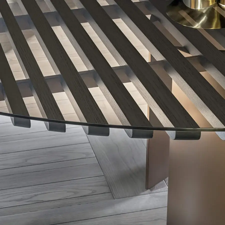 Superior Contemporary table with a round tempered glass top and warm charcoal ash wood blockboard base built with varnished steel accents