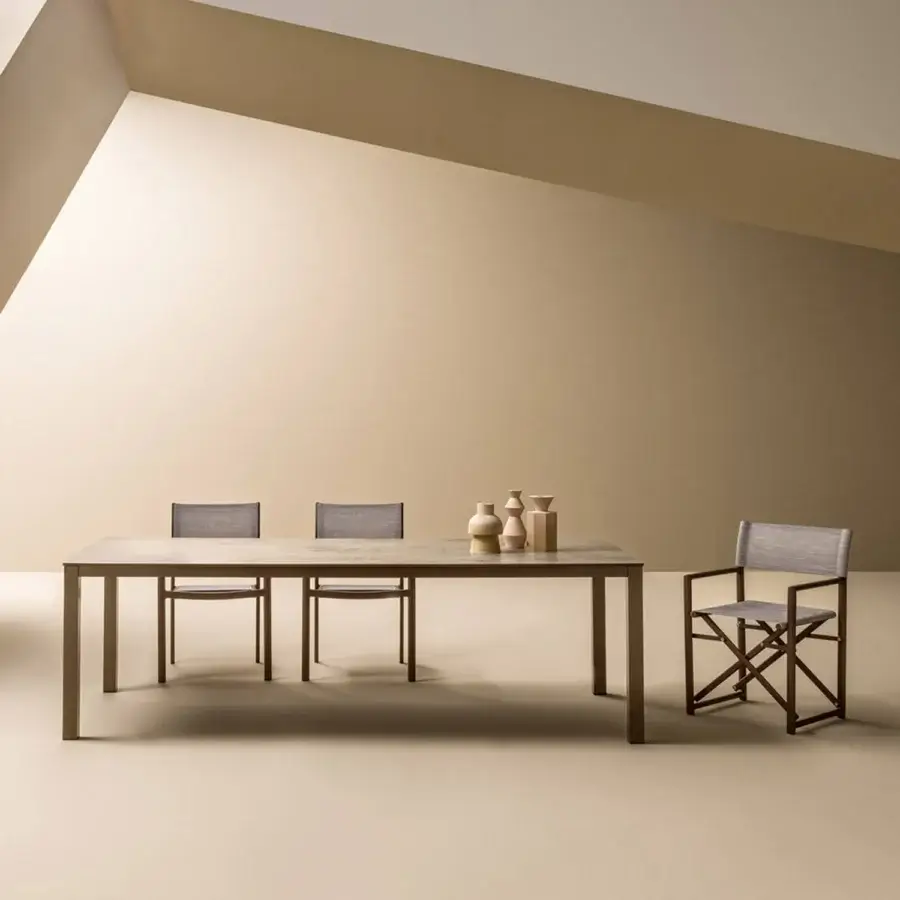 Distinguished Varaschin Victor table crafted in Italy with a textured neutral brown wooden tabletop and matte brown-grey metal legs