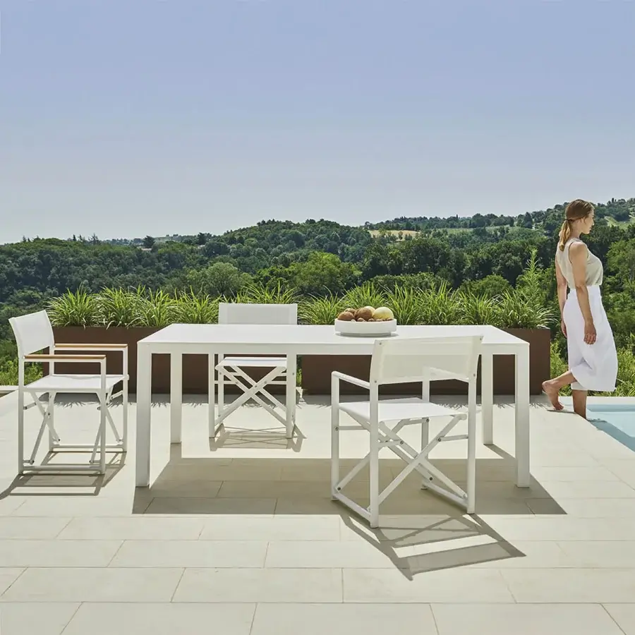 Distinguished Varaschin Victor table crafted in Italy with a smooth matte white metal finish and minimalist aesthetic