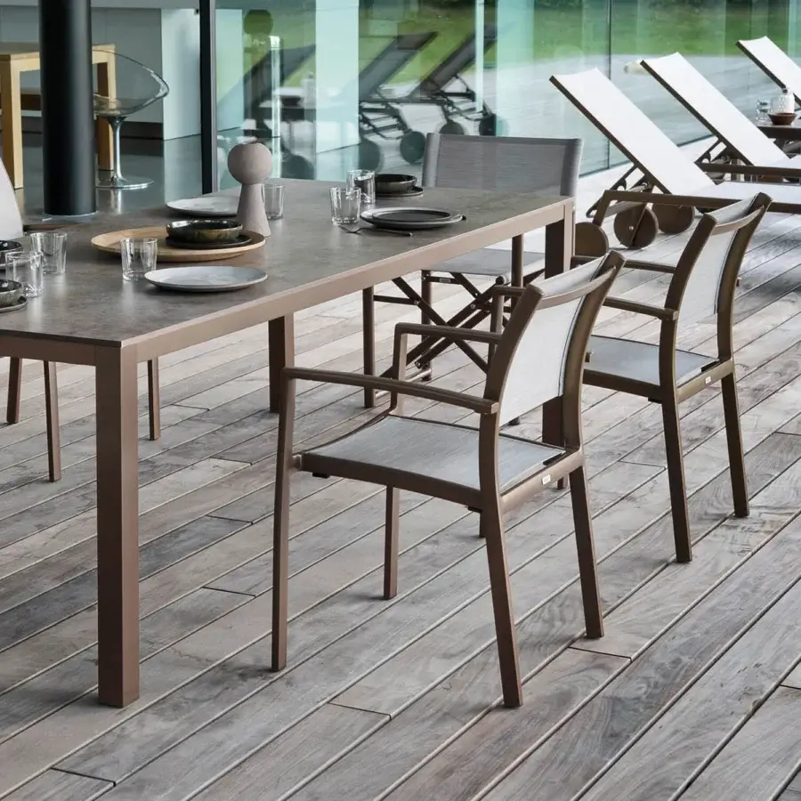 Exceptional Varaschin Victor armchair with metal frame and woven textile in a muted brown tone offering stackable functionality