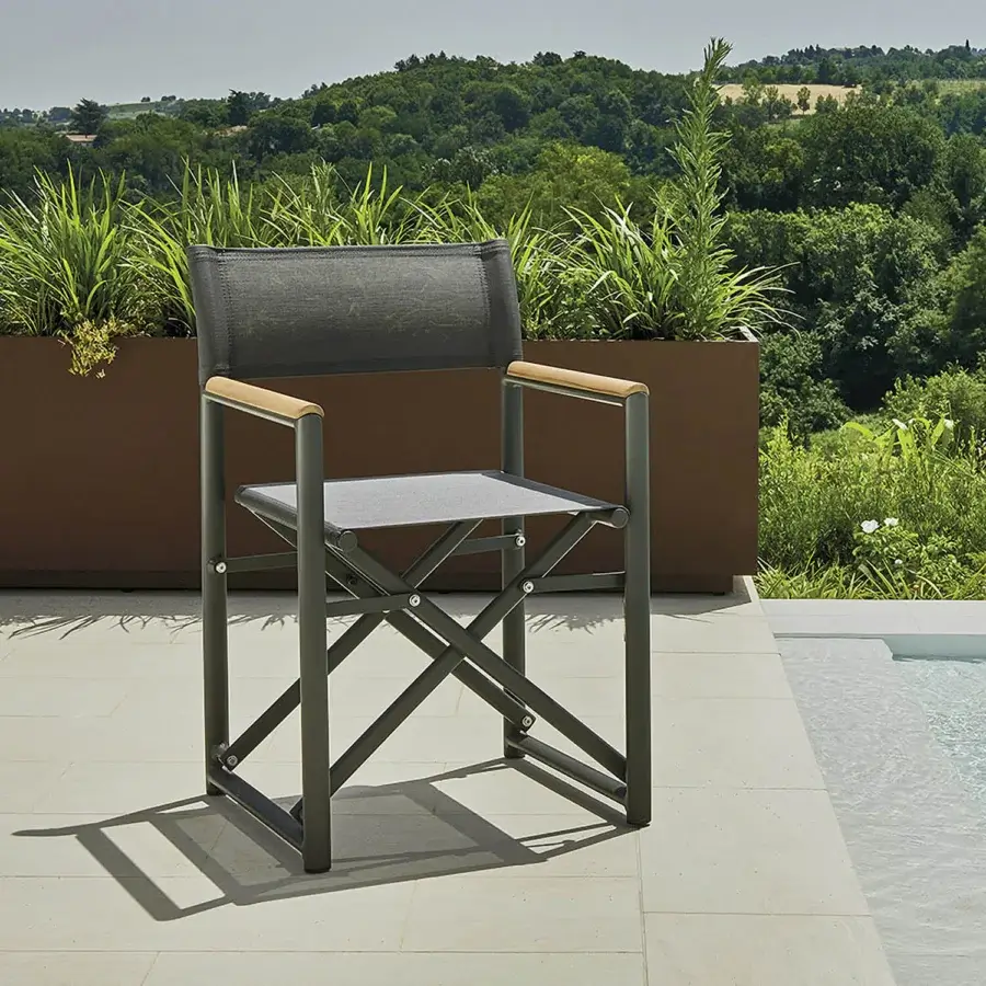 Distinctive Varaschin Victor armchair with muted gray quilted fabric, dark gray metal frame and refined teak wood armrests