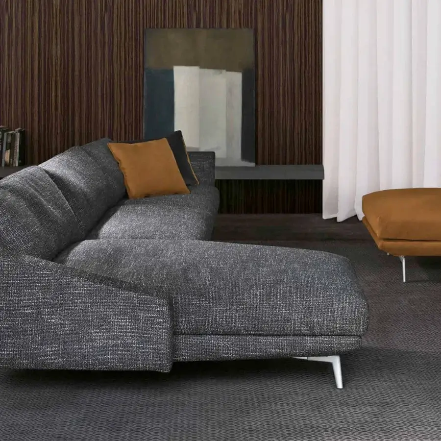 Superior CTS Salotti Urban sectional with dark gray textured textile and silver finished aluminum feet, complemented with warm brown cushions