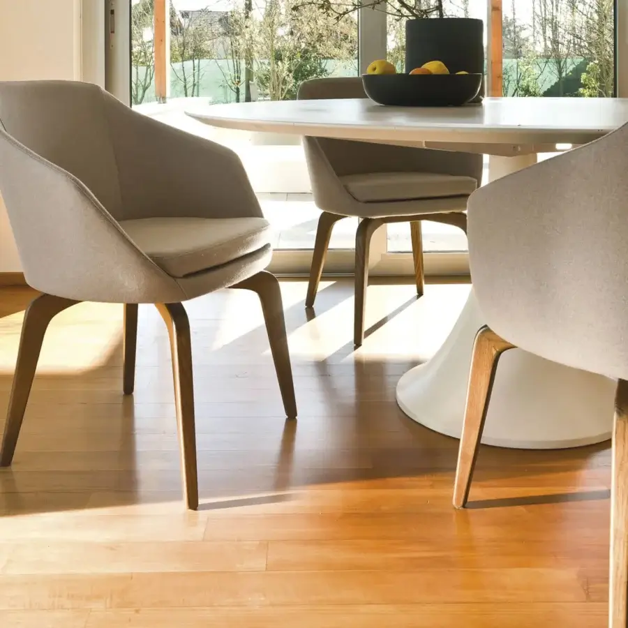 Elegant CTS Salotti Anna armchair upholstered in light gray fabric with a natural stained ash wood base