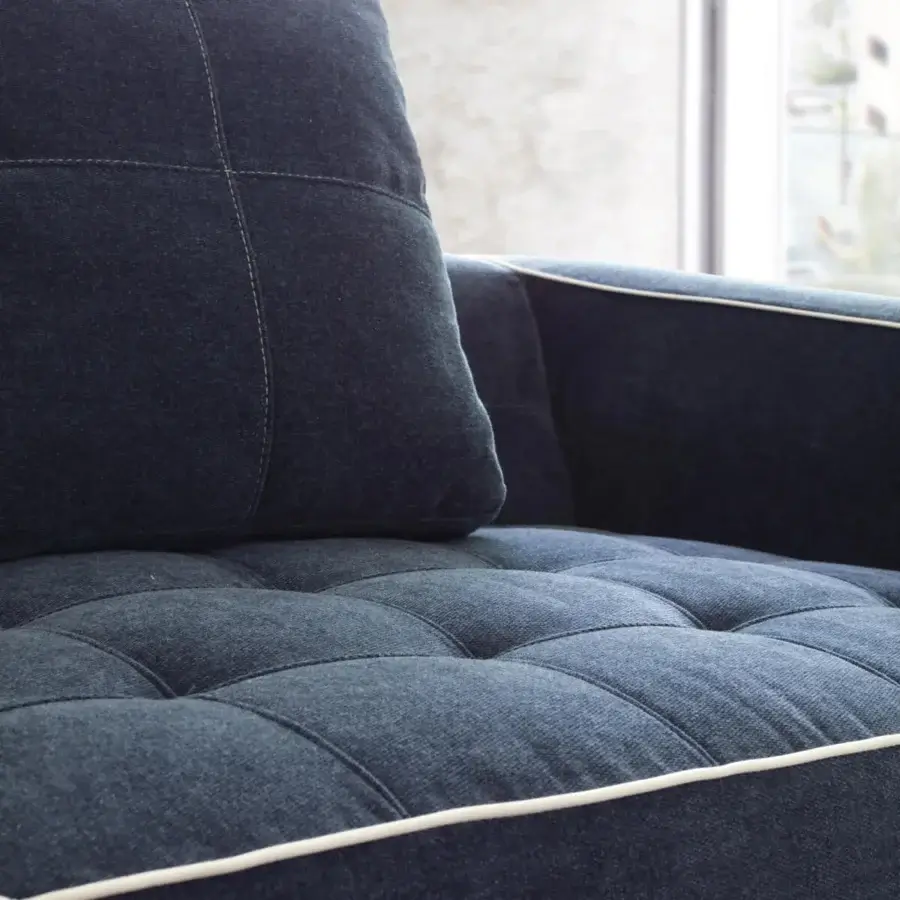 Refined CTS Salotti Clay sofa with dark blue-grey textile upholstery, quilted seat cushions and stained beech base crafting timeless comfort