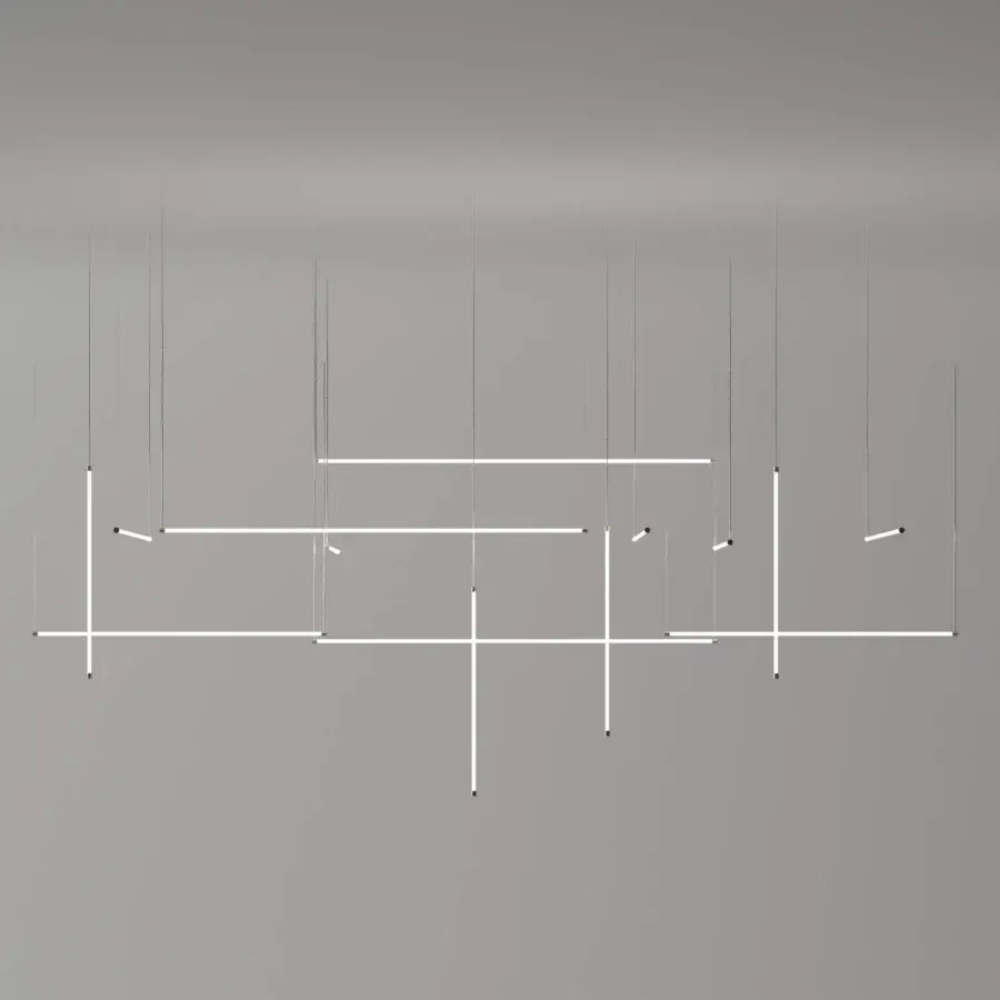 Elegant Stillux Line 13 suspension lamp with interconnected matte white aluminum tubes and a warm glow