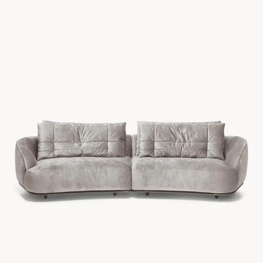 Superior Visionnaire Holden sofa with warm gray textured textile and quilted goose down cushions supported by a shaped wooden base