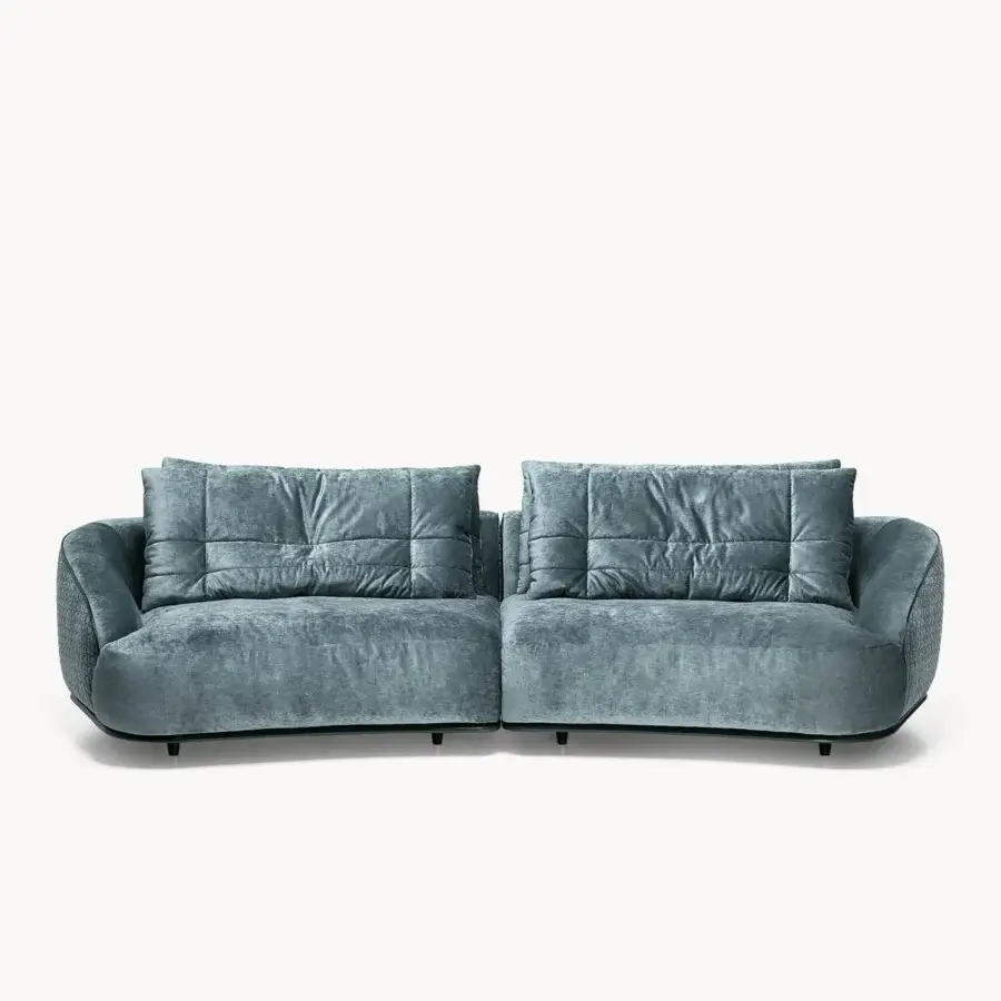 Distinguished Visionnaire Holden sofa with teal-blue textile, quilted padding and dark wood legs