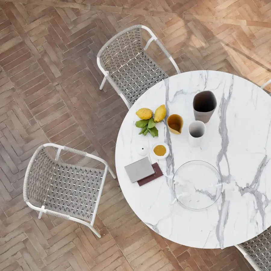 Superior Roberti Rattan Capri armchair crafted with durable searope and powder-coated aluminum in a white finish