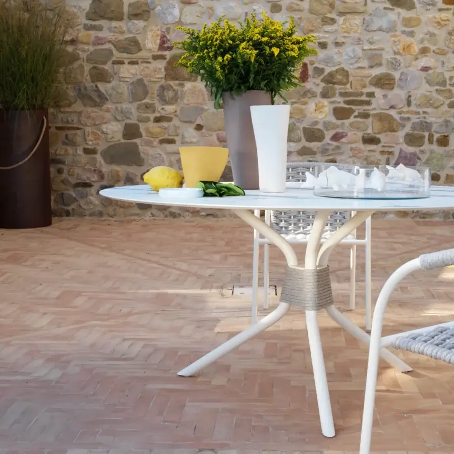 Superior Roberti Rattan Capri table with powder-coated steel base and HPL top in white finish