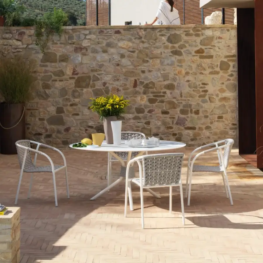 Elegant Roberti Rattan Capri table with durable HPL top and powder-coated 304 steel base crafted with searope detailing