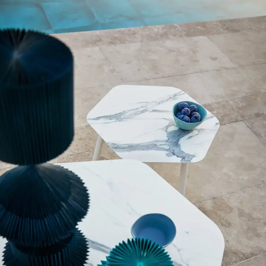 Elegant Roberti Rattan Capri table with hexagonal HPL surface in white marble-like material and polished finish