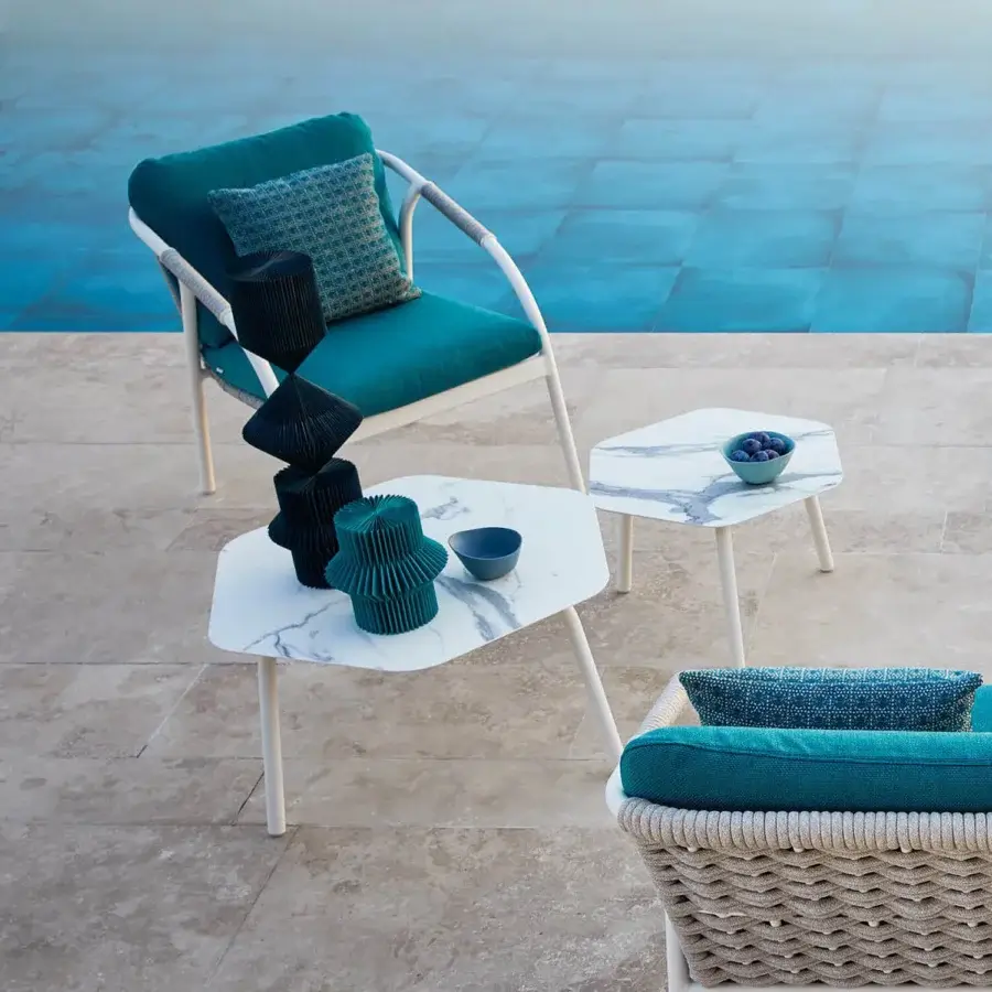 Exceptional Roberti Rattan Capri table with hexagonal HPL surface in marble-like gray and white veining, built with powder-coated aluminum legs