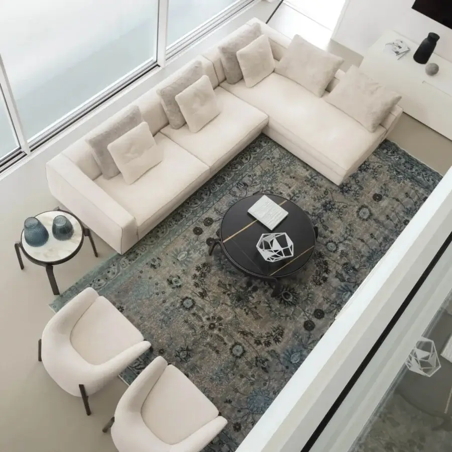 Elegant CTS Salotti Clay sectional upholstered in smooth neutral beige textile with refined contrasting piping and quilted seat cushions