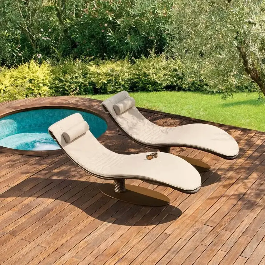 Elegant Roberti Rattan Caribe lounger crafted in chocolate Sunloom weaving with a polyester powder-coated aluminum frame