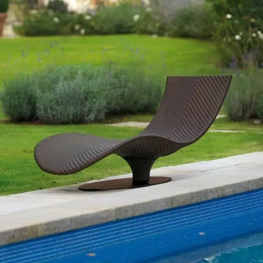 Exceptional Roberti Rattan Caribe lounger built with chocolate Sunloom weaving and polyester powder-coated aluminum frame