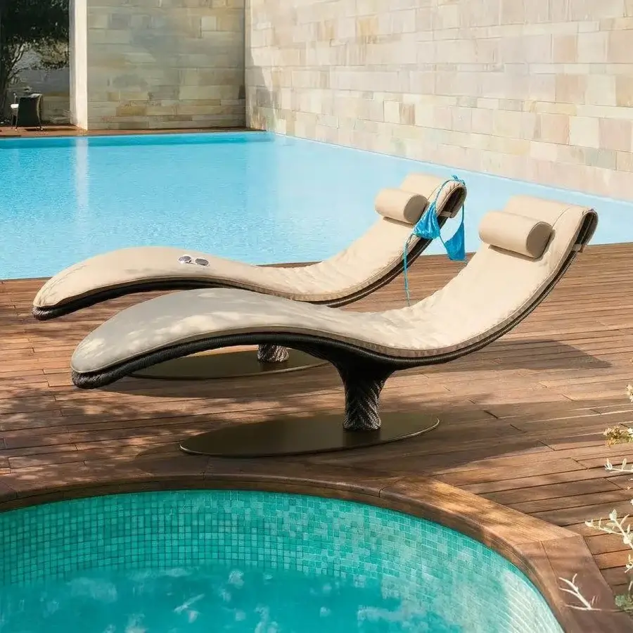 Distinguished Roberti Rattan Caribe lounger crafted with chocolate Sunloom weaving and a polyester powder-coated aluminum frame