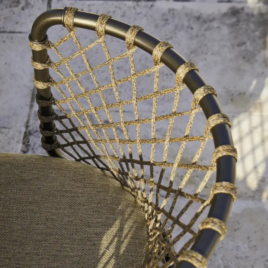 Distinguished Roberti Rattan Charme armchair with a powder-coated steel frame and hand-woven beige textile for comfortable seating