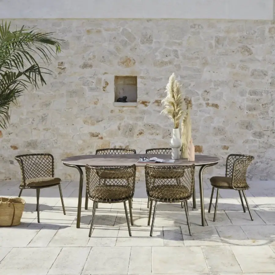 Lavish Roberti Rattan Charme armchair crafted with a powder-coated 304 steel frame and dark brown Flat Trendyrope weave