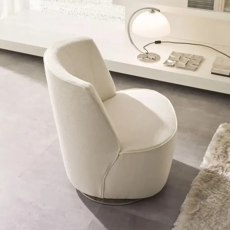 Distinguished CTS Salotti Cocoon lounge chair with softly contoured form and light beige subtly woven textile upholstery plus dark-toned metal swivel base