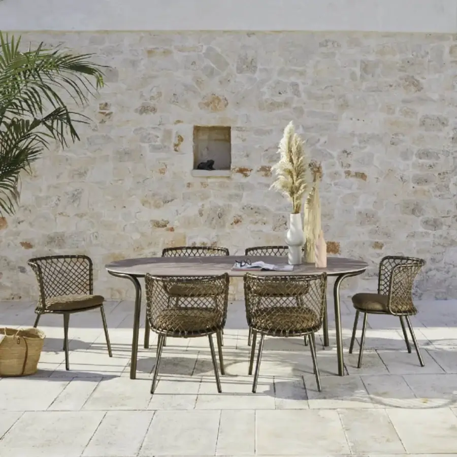 Distinguished Roberti Rattan Charme table with medium-toned brown wood grain HPL top and powder-coated 304 steel base